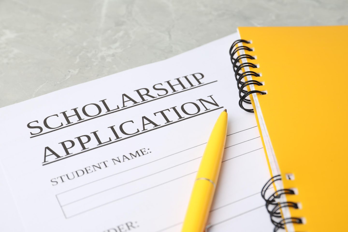 Scholarship application form with yellow notebook 2026 03 27 00 38 33 utc