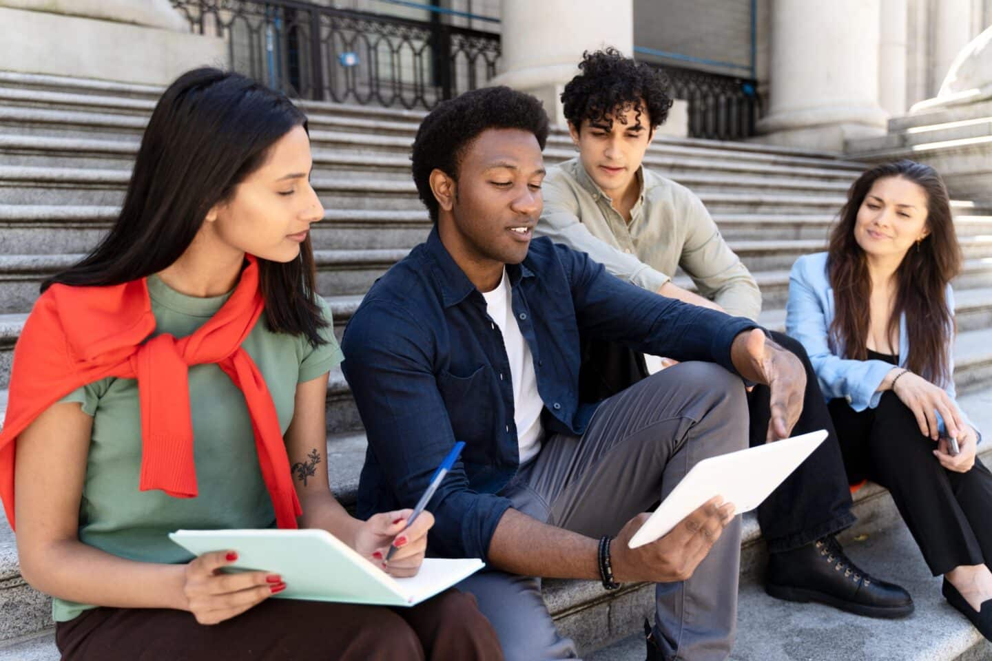 Students collaborating on steps outside college bu 2026 03 19 07 49 41 utc